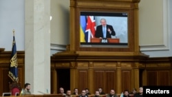 Ukraine's President Volodymyr Zelenskiy attends a session of a parliament while British Prime Minister Boris Johnson addresses Ukrainian lawmakers via videolink, as Russia's attack on Ukraine continues, in Kyiv, Ukraine May 3, 2022.