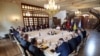 Russian, top left, and Ukranian, right, delegations meet along with United Nation observers, left, and Turkish Defense Ministry members in Istanbul, Turkey, July 13, 2022.