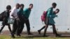 FILE - Students leave school at the end of the day in a suburb of Johannesburg, South Africa.