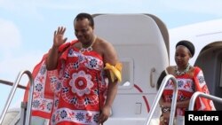 FILE - King of Swaziland Mswati III and one of his 13 wives arrive at Katunayake International airport in Colombo, Sri Lanka, August 13, 2012. 