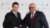 South Africa's President Jacob Zuma (R) is greeted by France's Prime Minister Manuel Valls as he arrives for the COP21 United Nations Climate Change Conference on Nov. 30, 2015 in Le Bourget, outside Paris.