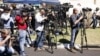 (File) Journalists report from outside the former South African President Nelson Mandela's house, in Johannesburg, South Africa Monday, Sept. 2, 2013.