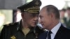  ရုရှားကာကွယ်ရေးဝန်ကြီး Sergei Shoigu (ဝဲ) နဲ့ လတ်တလော ပြန်လည်ရွေးကောက်ခံရသူ ရုရှားသမ္မ Putin (ယာ) 