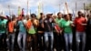 Mine workers gather at Wonderkop stadium outside the Lonmin mine in Rustenburg, northwest of Johannesburg, Jan. 29, 2014. 