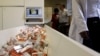 A newly mechanized pharmaceutical machine that helps pharmacists dispense medicine is loaded with ARV medication, at the U.S. sponsored Themba Lethu, HIV/AIDS Clinic, at the Helen Joseph hospital, in Johannesburg, South Africa, Nov. 15, 2012.