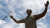 FILE - A bronze statue of the late former South African President Nelson Mandela is unveiled at the Union Buildings in Pretoria, Dec. 16, 2013.