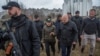 International Criminal Court Prosecutor Khan and Ukraine's Prosecutor General Venediktova visit a site of a mass grave in the town of Bucha